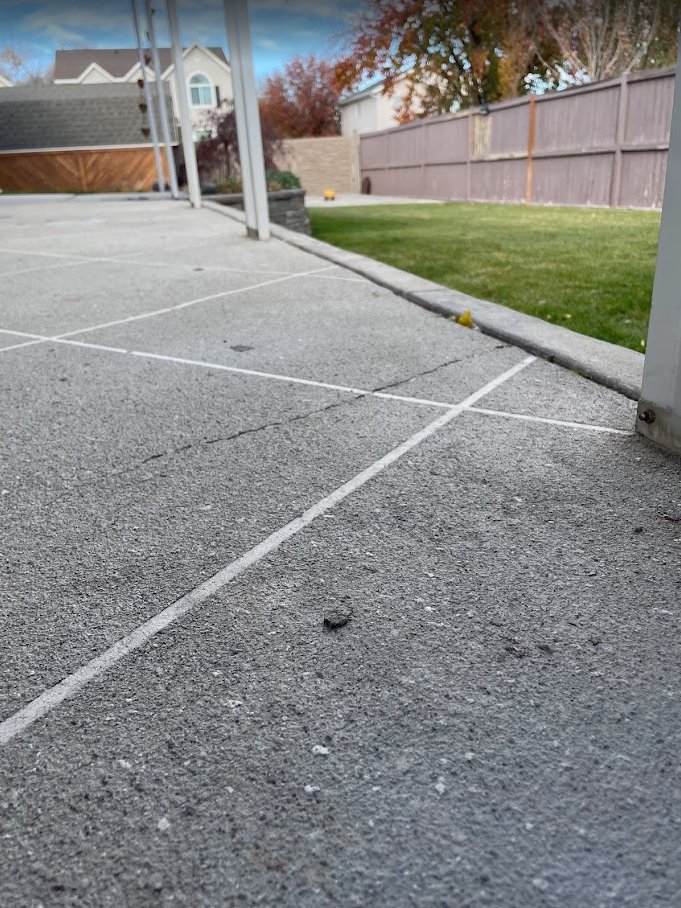 Level back patio in Draper after concrete lifting by Wasatch Concrete Lifting