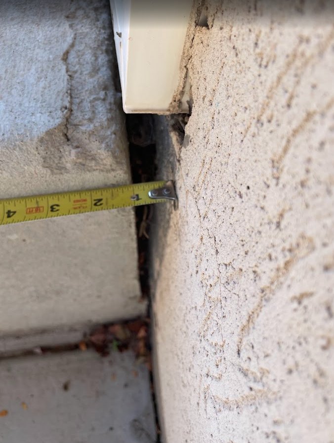 Provo patio stairs pulled away from house due to concrete settlement