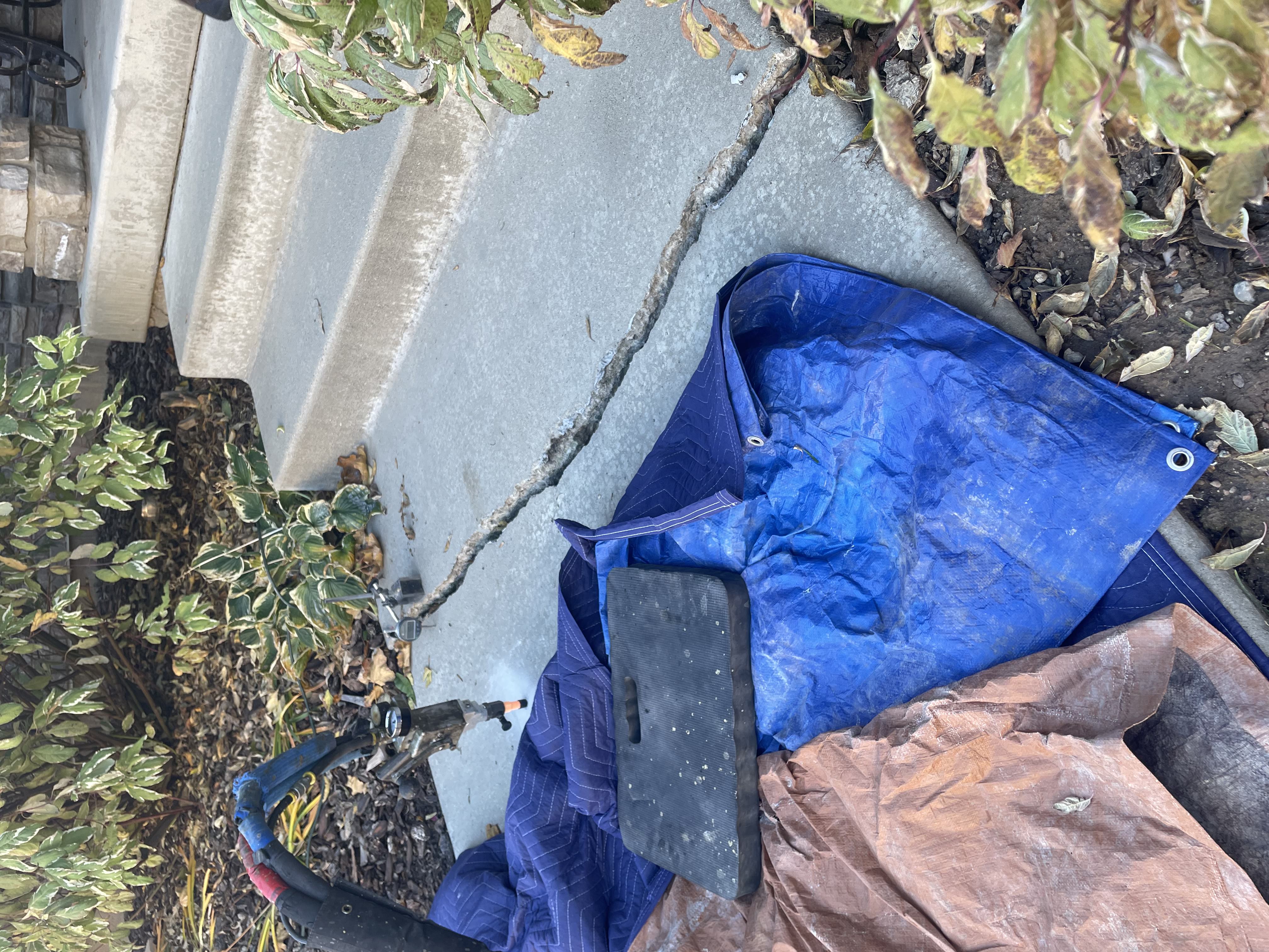 Sunken concrete walkway in Salt Lake City before lifting