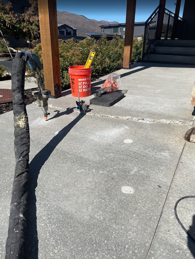 West Jordan walkway being lifted with polyurethane foam — equipment on slab